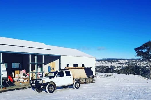 Monaro Plumbing vehicle at a snowy Snowy Mountains job site
